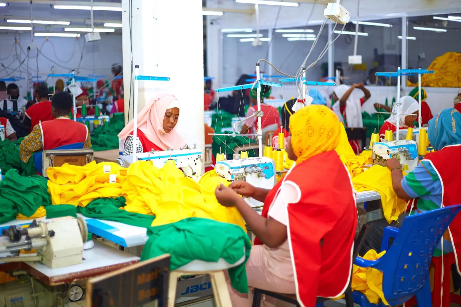 Wide view of the Swahili Knits sewing floor in production