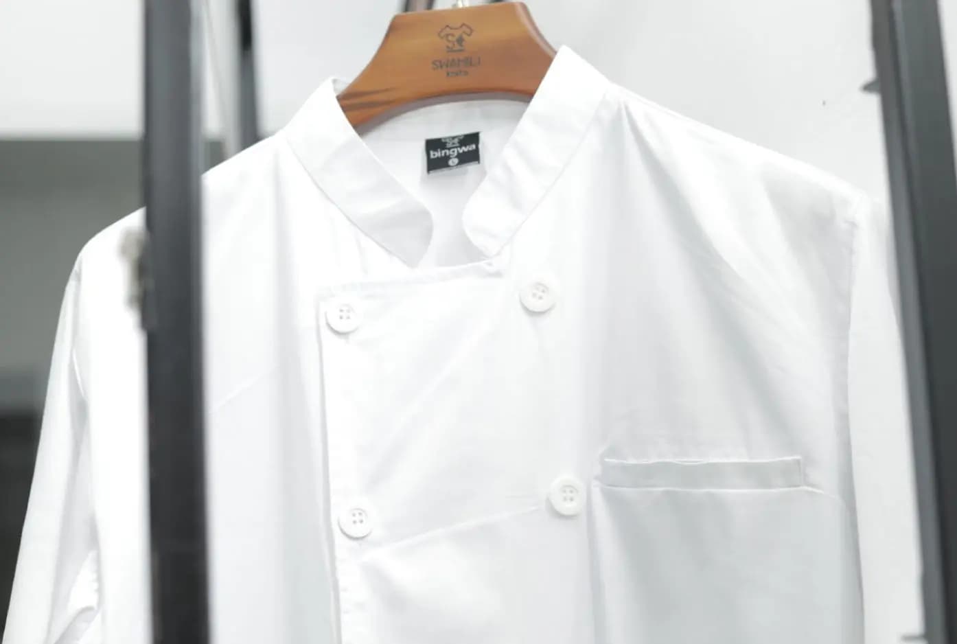 White chef jacket made at Swahili Knits