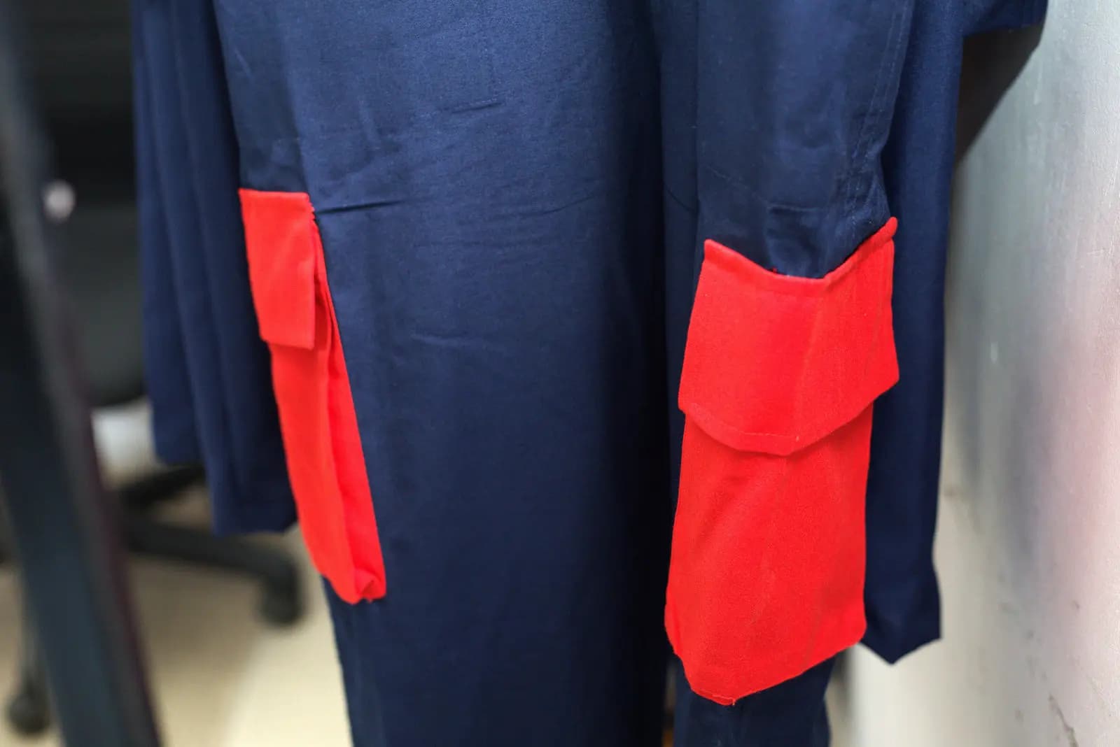 Contrast pocket detail on a navy workwear jacket