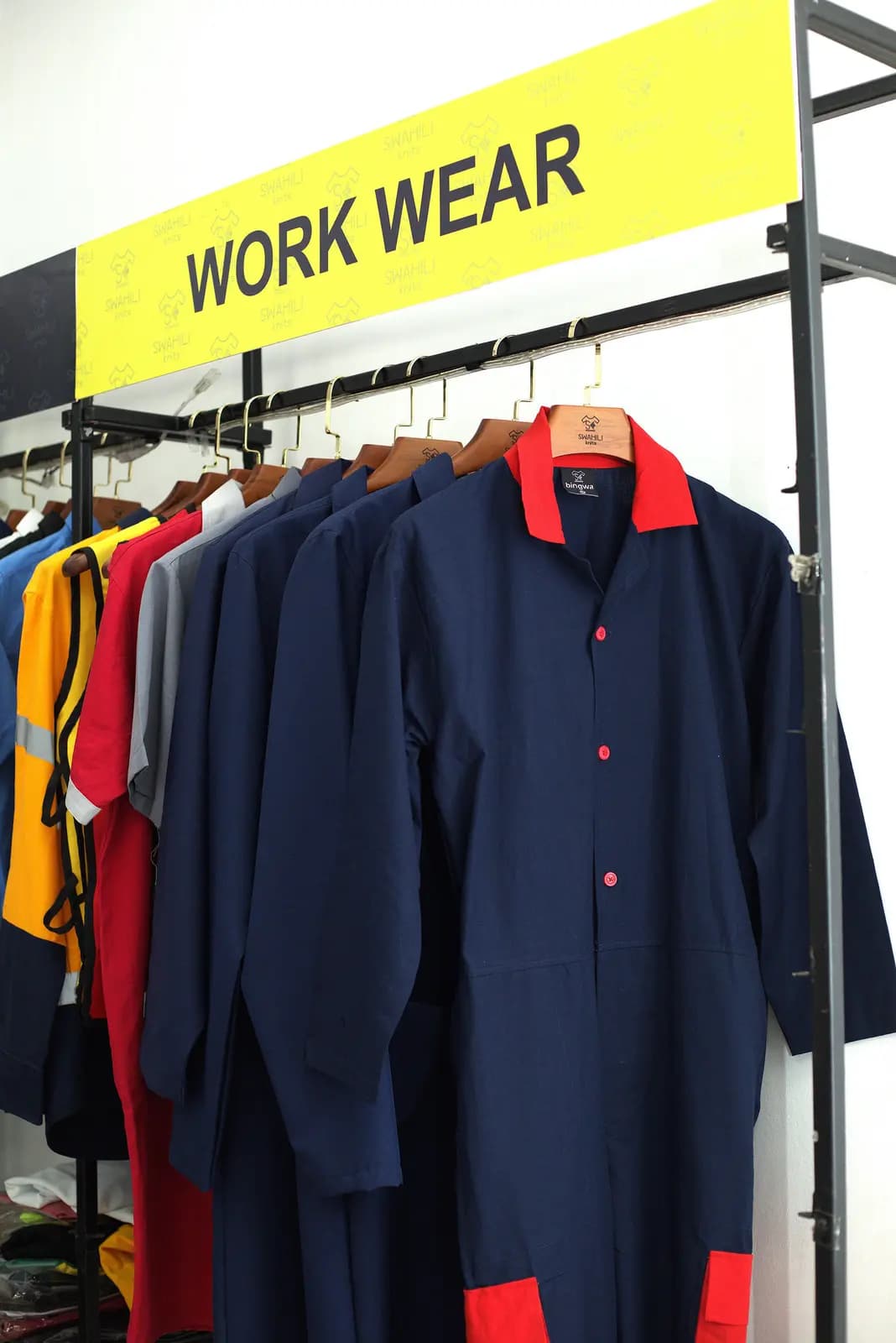 Navy work shirts with contrast trim on the workwear rail