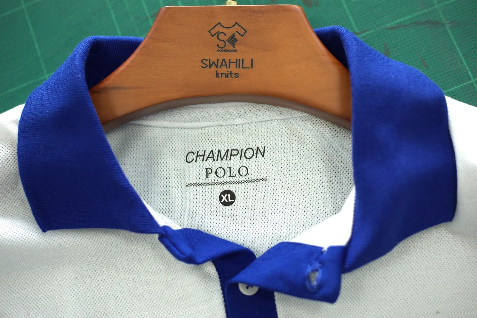 Champion Polo neck label inside a blue polo shirt
